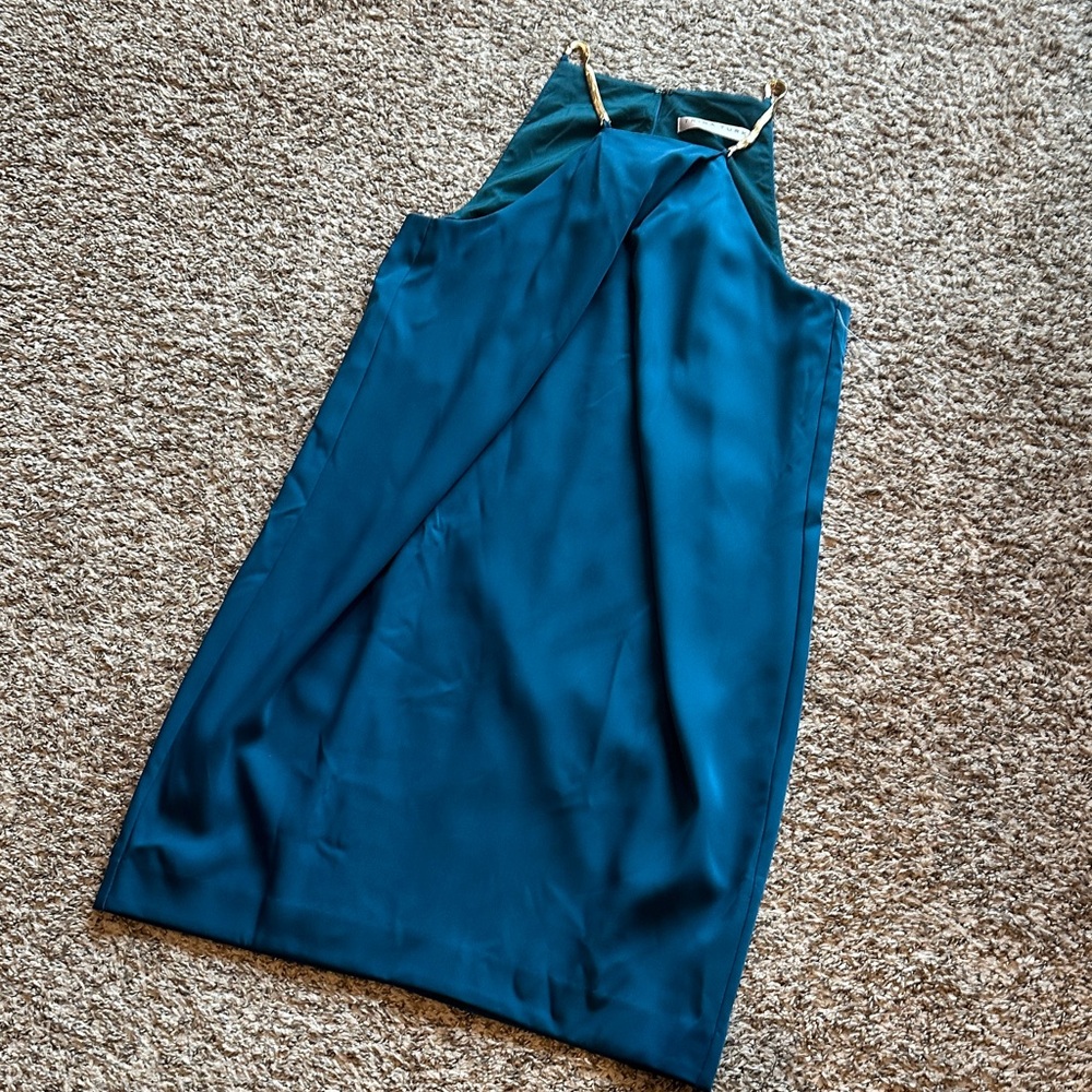 Elegant Teal Trina Turk Sleeveless Dress with gold chain accents
